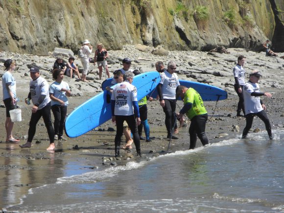 Volunteers in Operation Surf Assist  Veterans on the Beach.